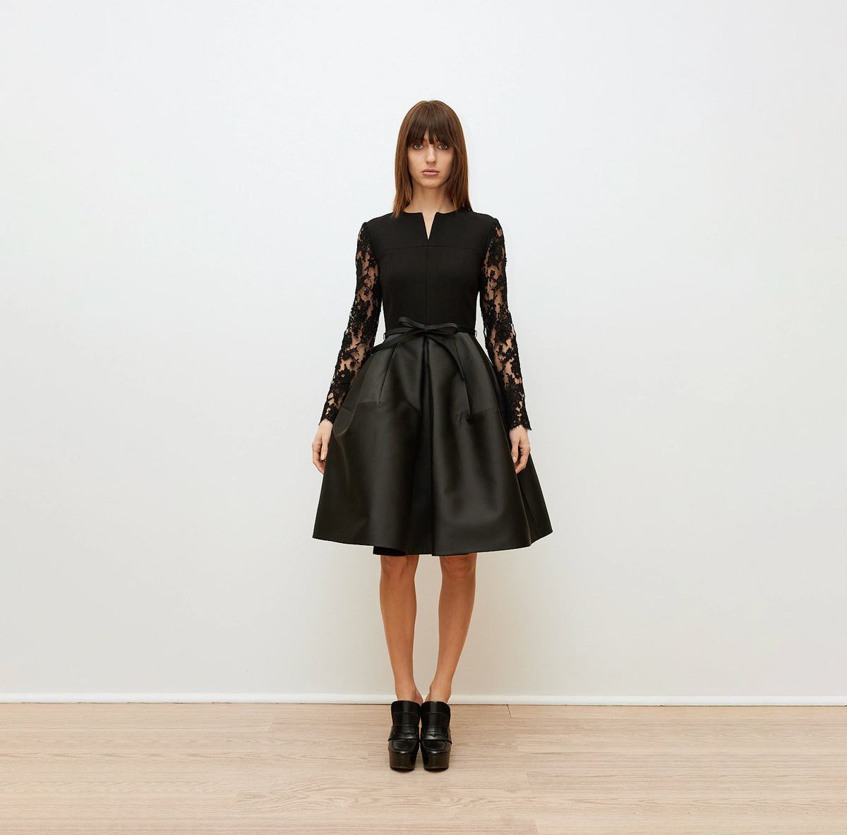Black Dress with Lace Sleeves and Sculptural Skirt