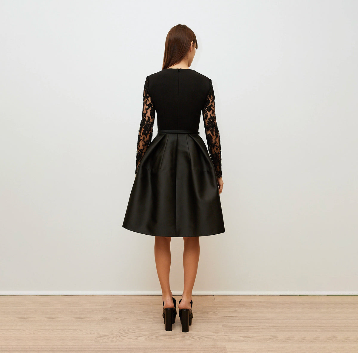 Black Dress with Lace Sleeves and Sculptural Skirt