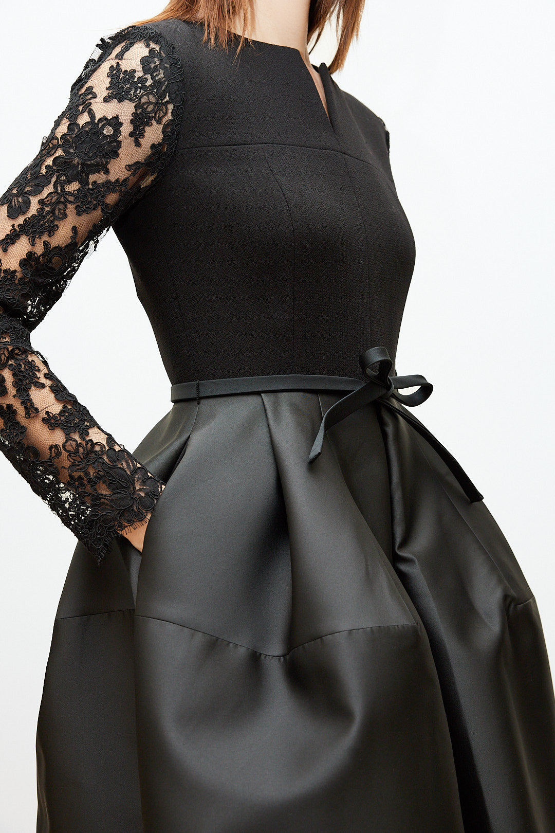 Black Dress with Lace Sleeves and Sculptural Skirt
