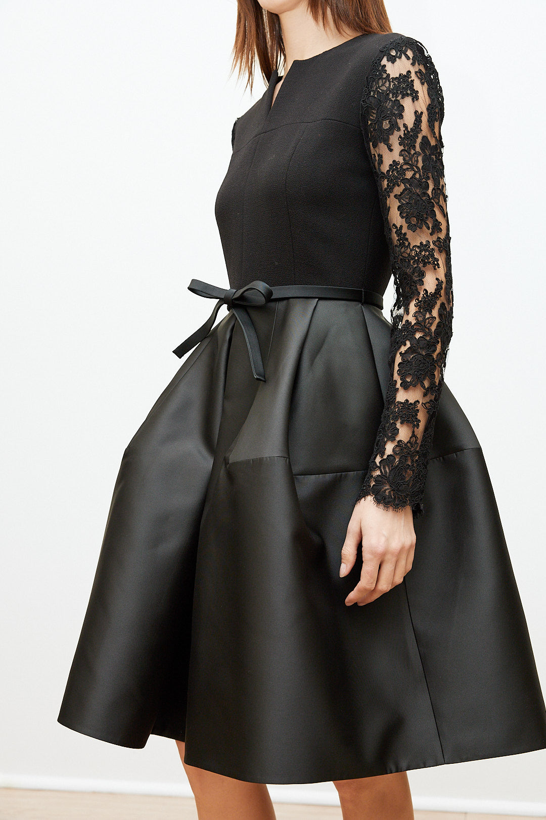 Black Dress with Lace Sleeves and Sculptural Skirt